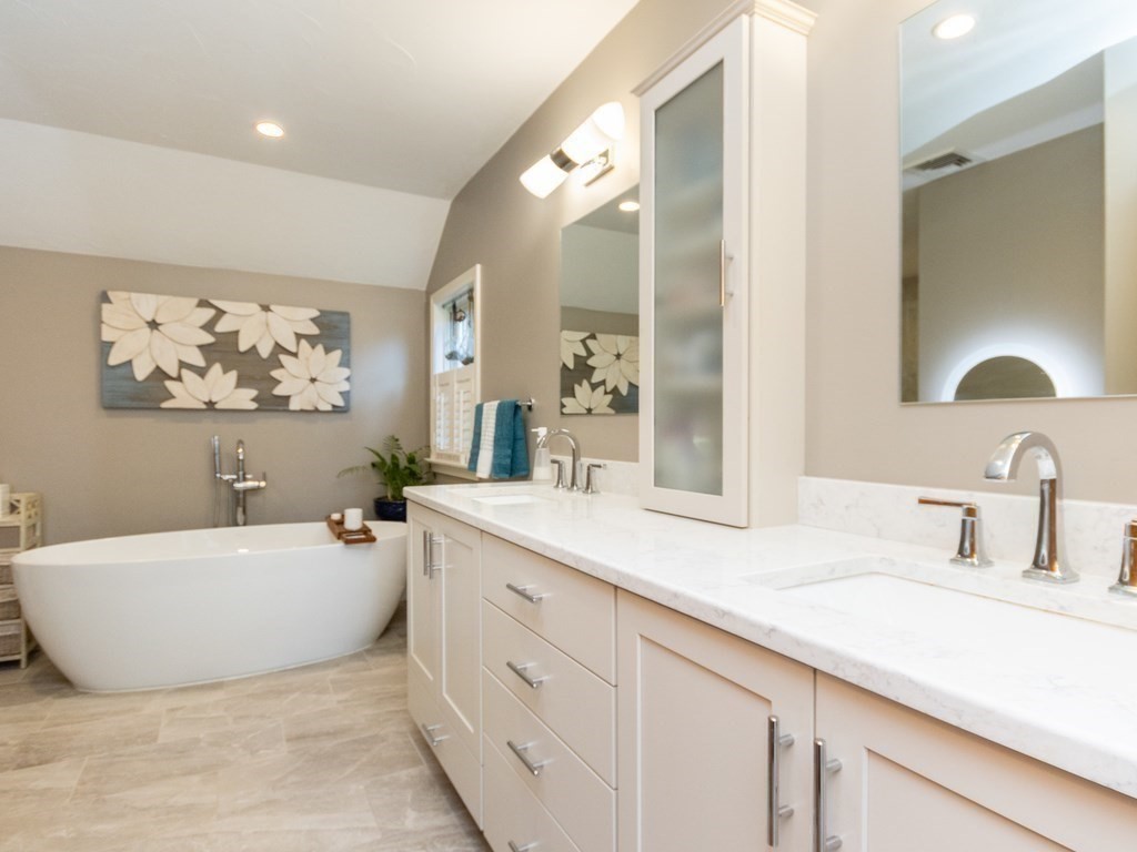 72 Emerson Road Walpole, MA 02032 - Photo 26 of 41 a bathroom with a tub sink and mirror