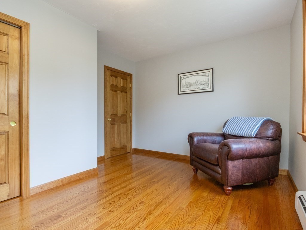 72 Emerson Road Walpole, MA 02032 - Photo 29 of 41 a living room with furniture and a wooden floor