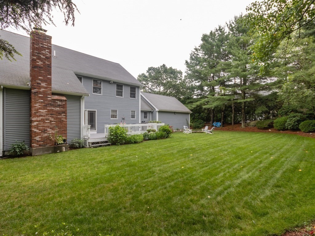 72 Emerson Road Walpole, MA 02032 - Photo 40 of 41 a front view of house with yard and green space