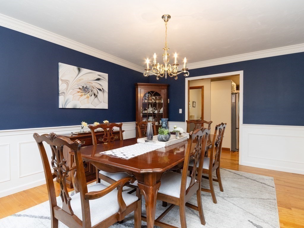 72 Emerson Road Walpole, MA 02032 - Photo 4 of 41 a view of a dining room with furniture a chandelier and wooden floor