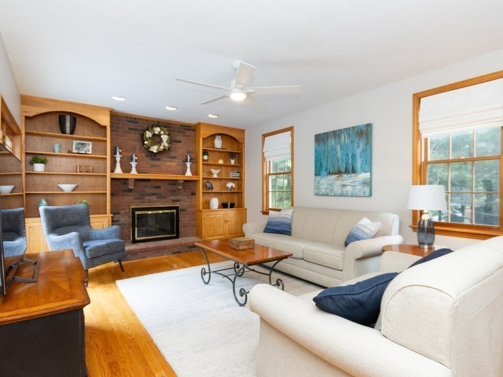 72 Emerson Road Walpole, MA 02032 - Photo 9 of 41 a living room with furniture large window and fireplace