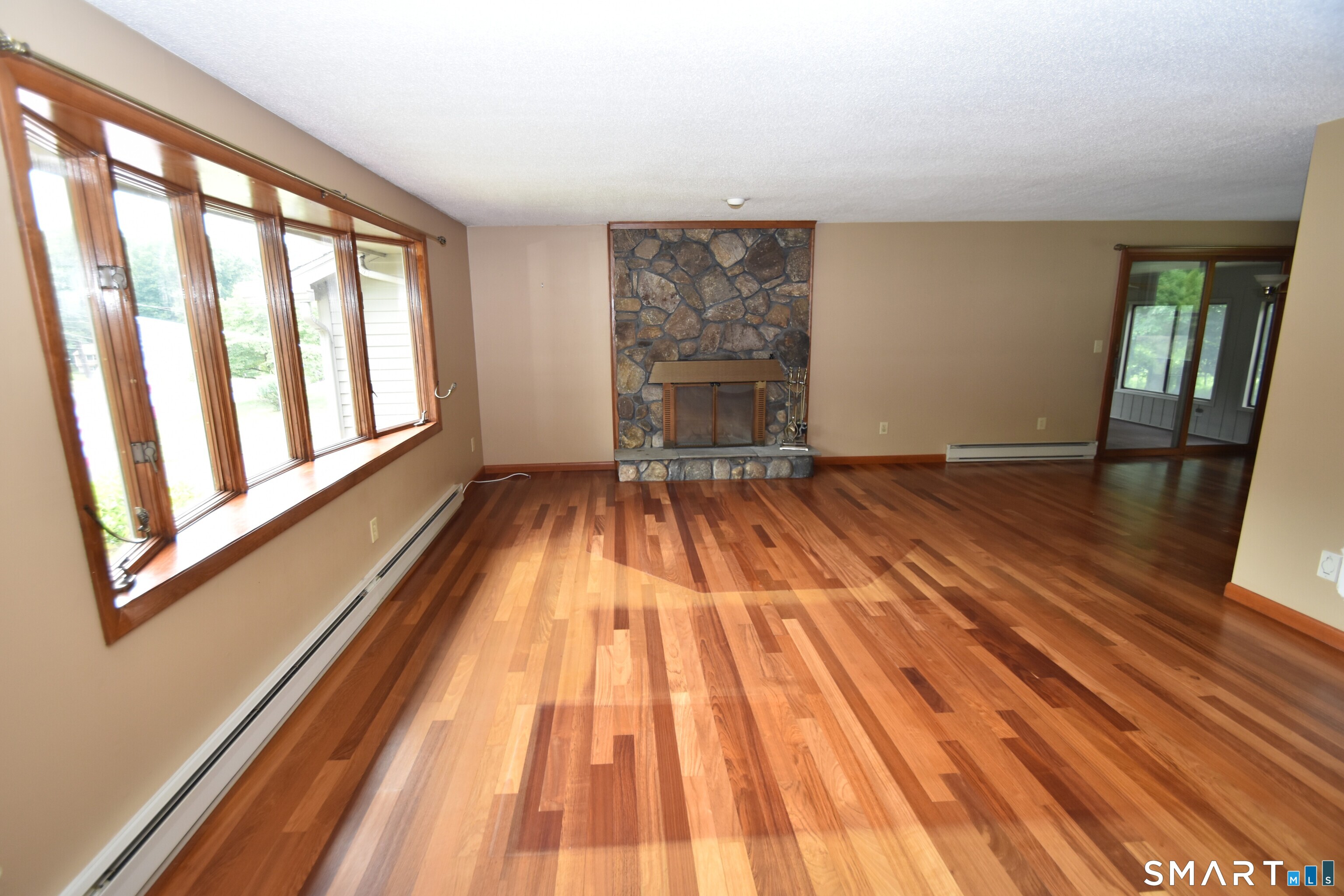 77 Winthrop Road Manchester, CT 06040 - Photo 4 of 17 Living Room with Stone Fireplace