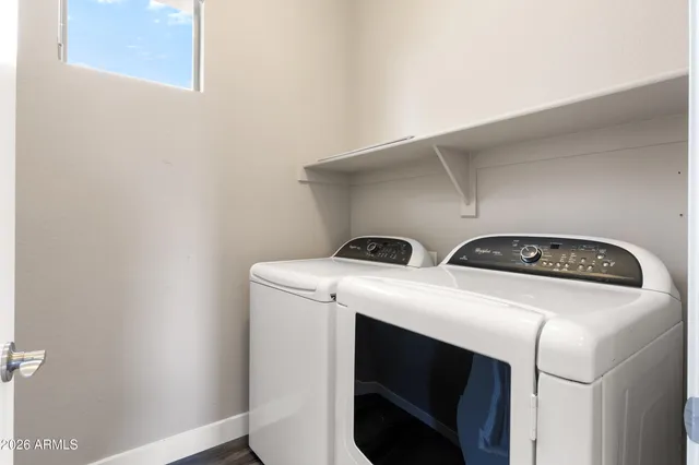 a utility room with dryer and washer