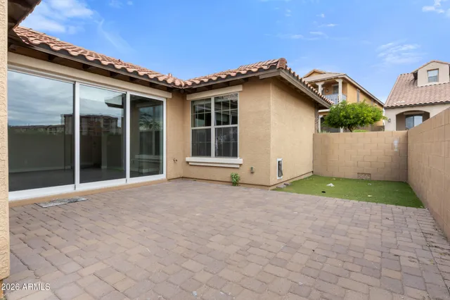 a view of a house with a yard and a garage