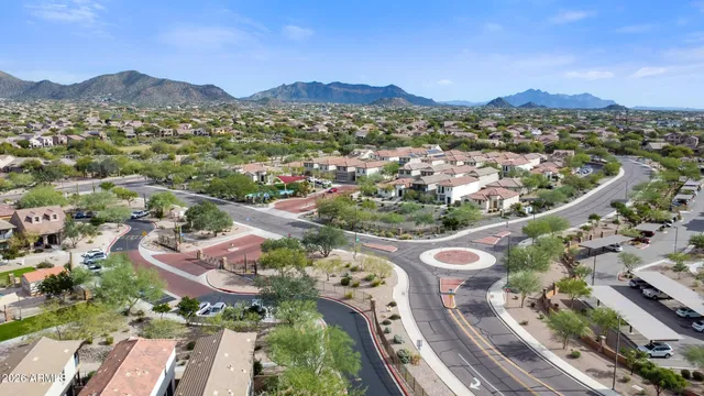 an aerial view of a city with mountains