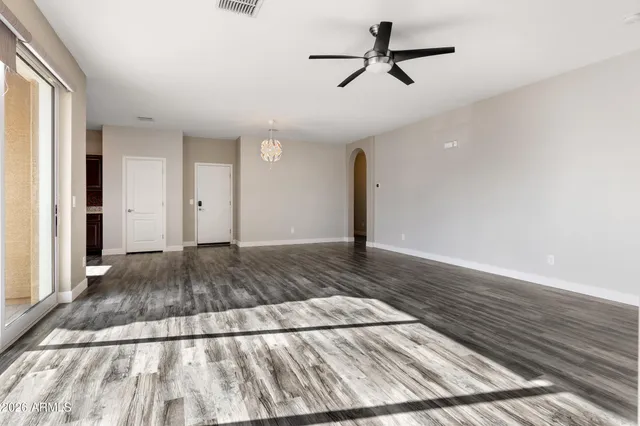 a view of a ceiling fan in wooden floor