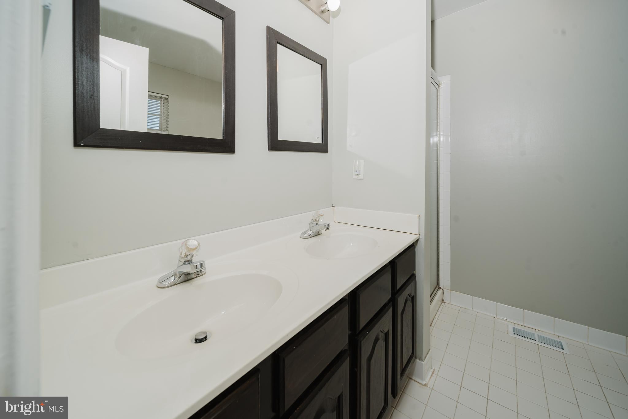 714 Kirkcaldy Way Abingdon, MD 21009 - Photo 13 of 34 a bathroom with a double vanity sink and mirror