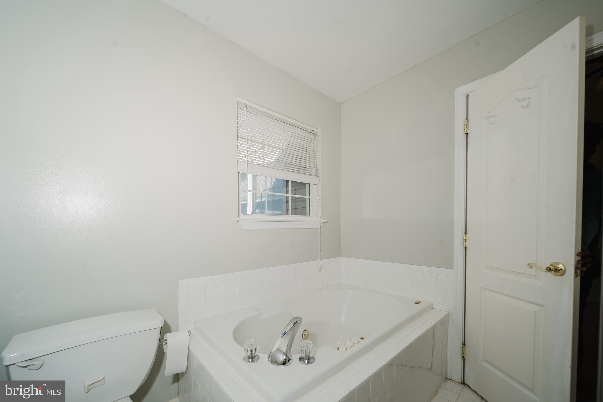 714 Kirkcaldy Way Abingdon, MD 21009 - Photo 16 of 34 a bathroom with a tub and toilet