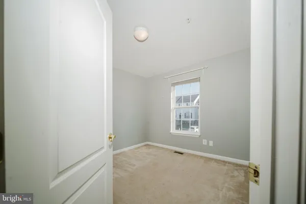 a view of a window in an empty room