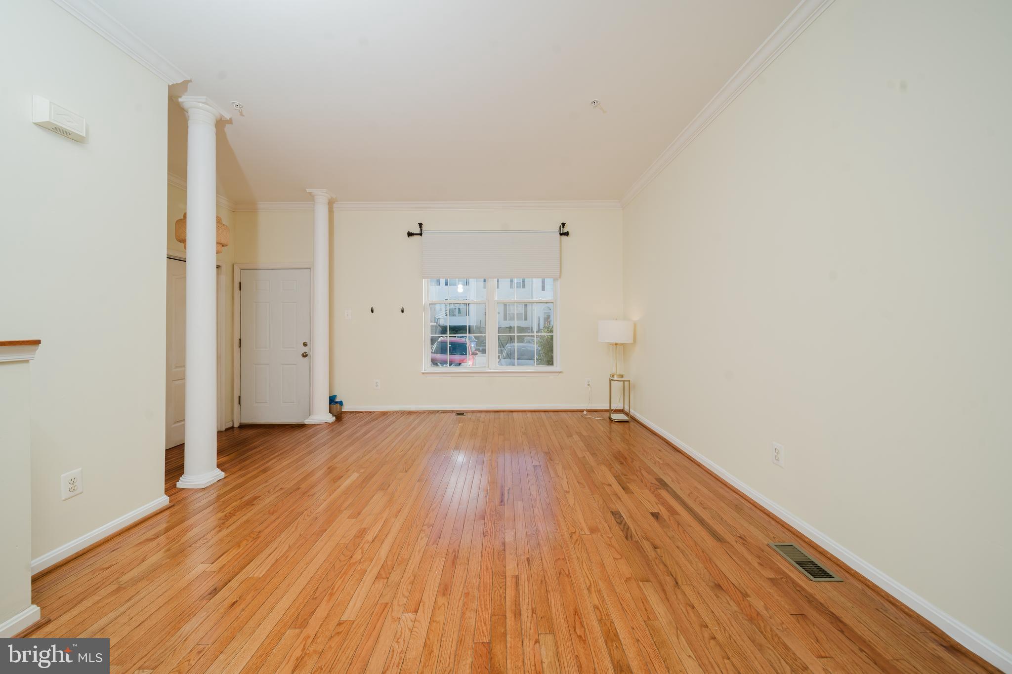 714 Kirkcaldy Way Abingdon, MD 21009 - Photo 2 of 34 an empty room with wooden floor and windows