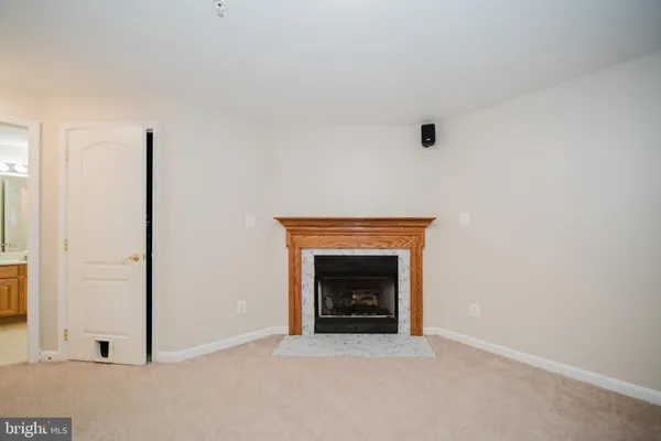 an empty room with fireplace