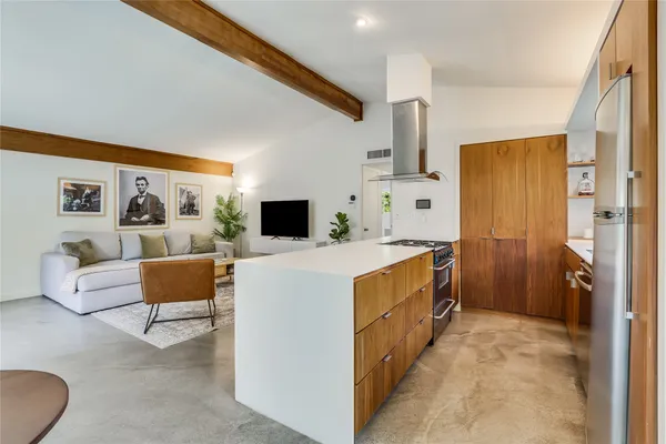 a spacious bedroom with a bed and a couch