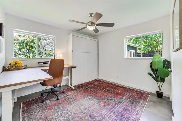 a workspace with furniture and a window
