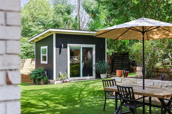 a view of a chair and table in the patio and a fire pit