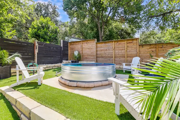 a patio with table and chairs