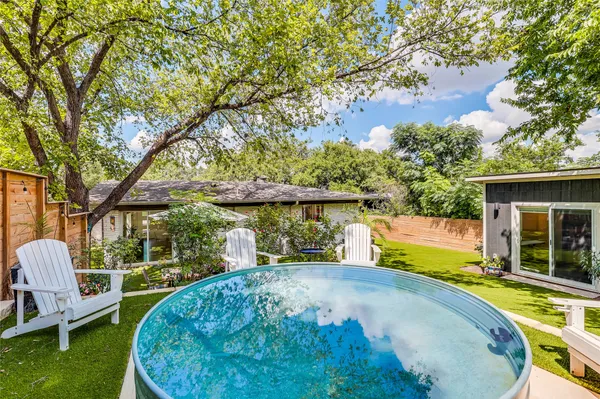 a view of a swimming pool with a patio