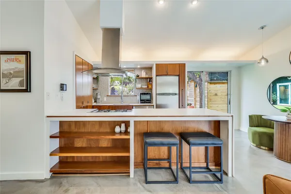 a kitchen with a table and chairs in it