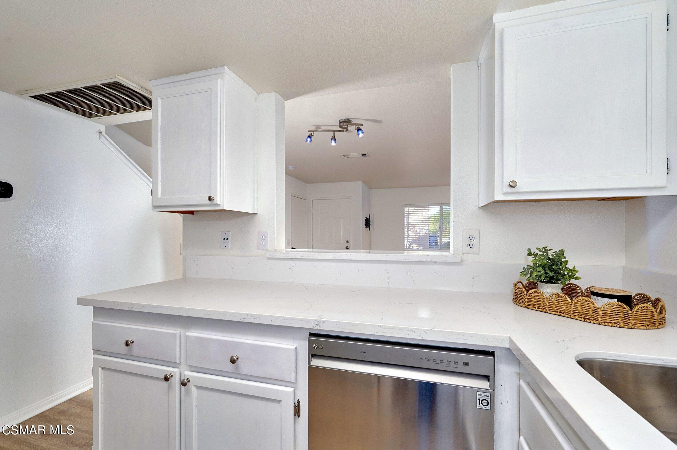 4508 Apricot Road, Unit B Simi Valley, CA 93063 - Photo 16 of 44 a kitchen with stainless steel appliances a white cabinets sink and stove