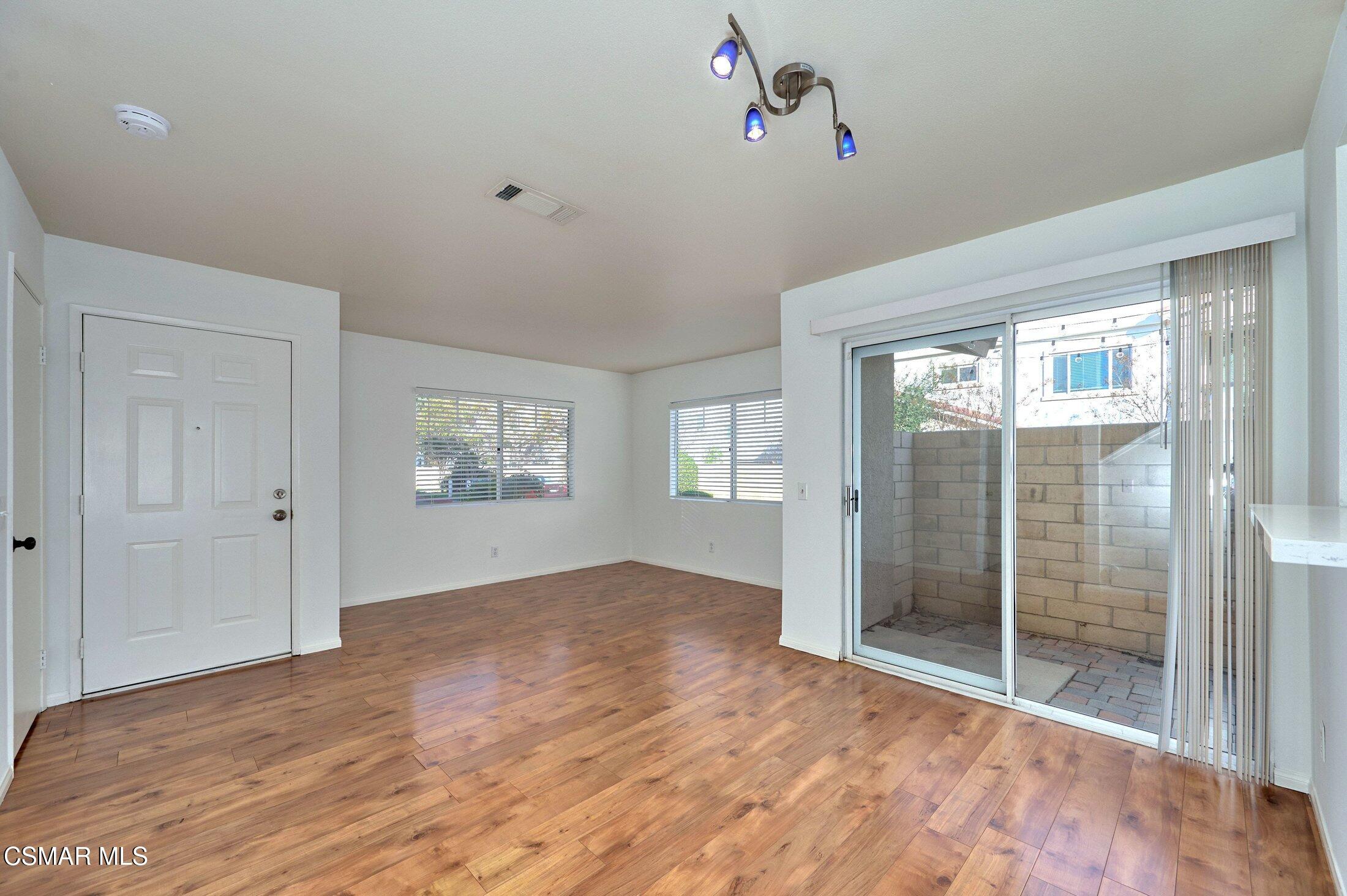 4508 Apricot Road, Unit B Simi Valley, CA 93063 - Photo 3 of 44 a view of an empty room with wooden floor and a window
