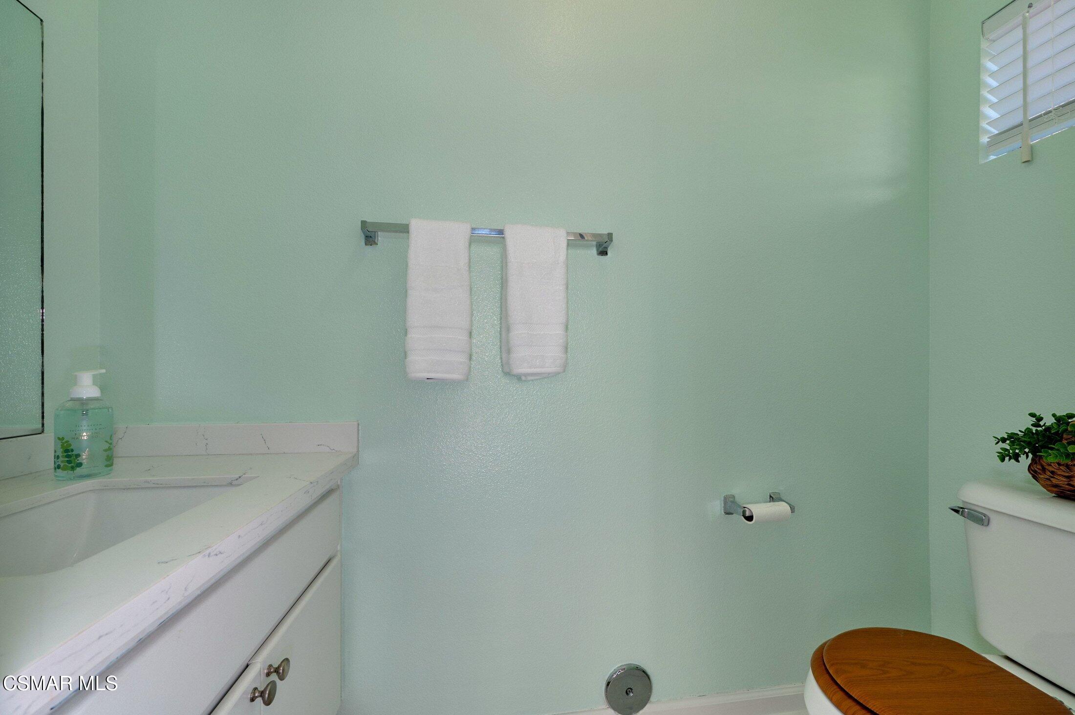 4508 Apricot Road, Unit B Simi Valley, CA 93063 - Photo 7 of 44 a bathroom with a granite countertop sink and a mirror
