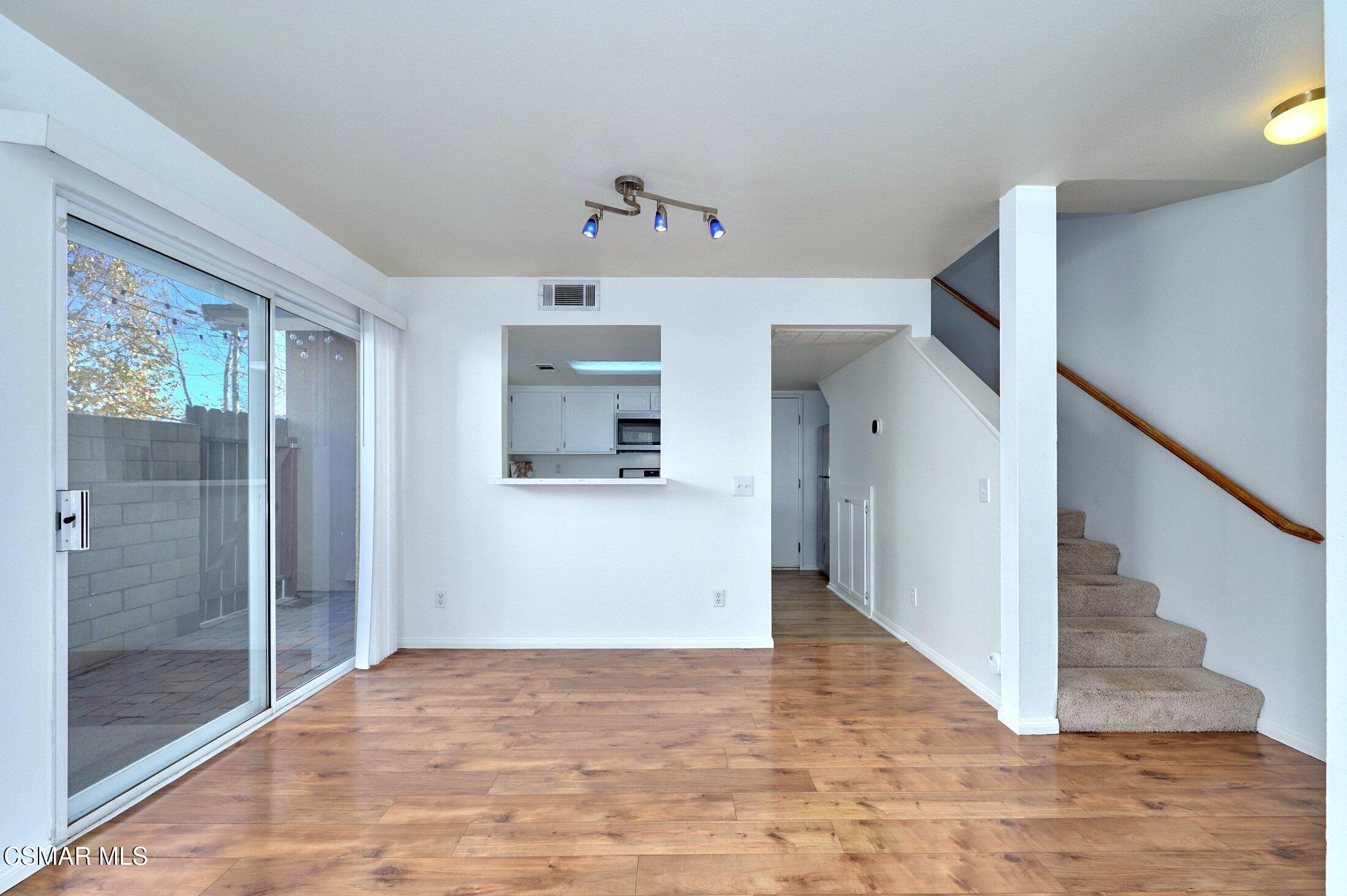 4508 Apricot Road, Unit B Simi Valley, CA 93063 - Photo 9 of 44 a view of hallway with stairs and wooden floor