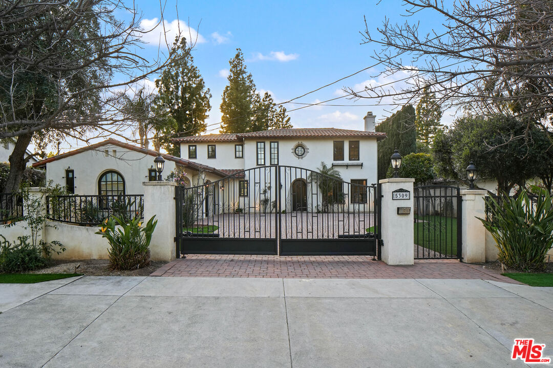 5309 Louise Avenue Encino, CA 91316 - Photo 2 of 38 a view of a house with a yard and potted plants