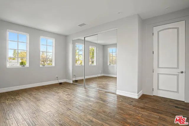 a bathroom with a shower a toilet and a sink
