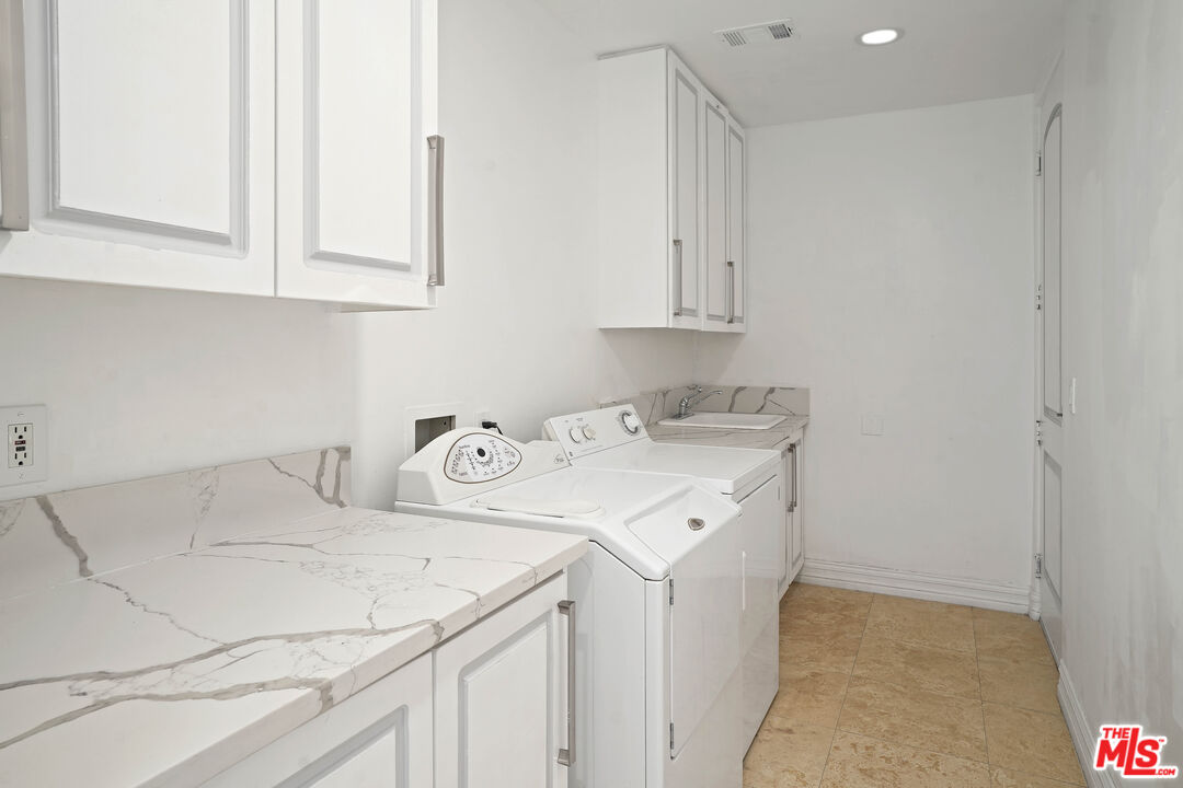 5309 Louise Avenue Encino, CA 91316 - Photo 33 of 38 a utility room with dryer and washer