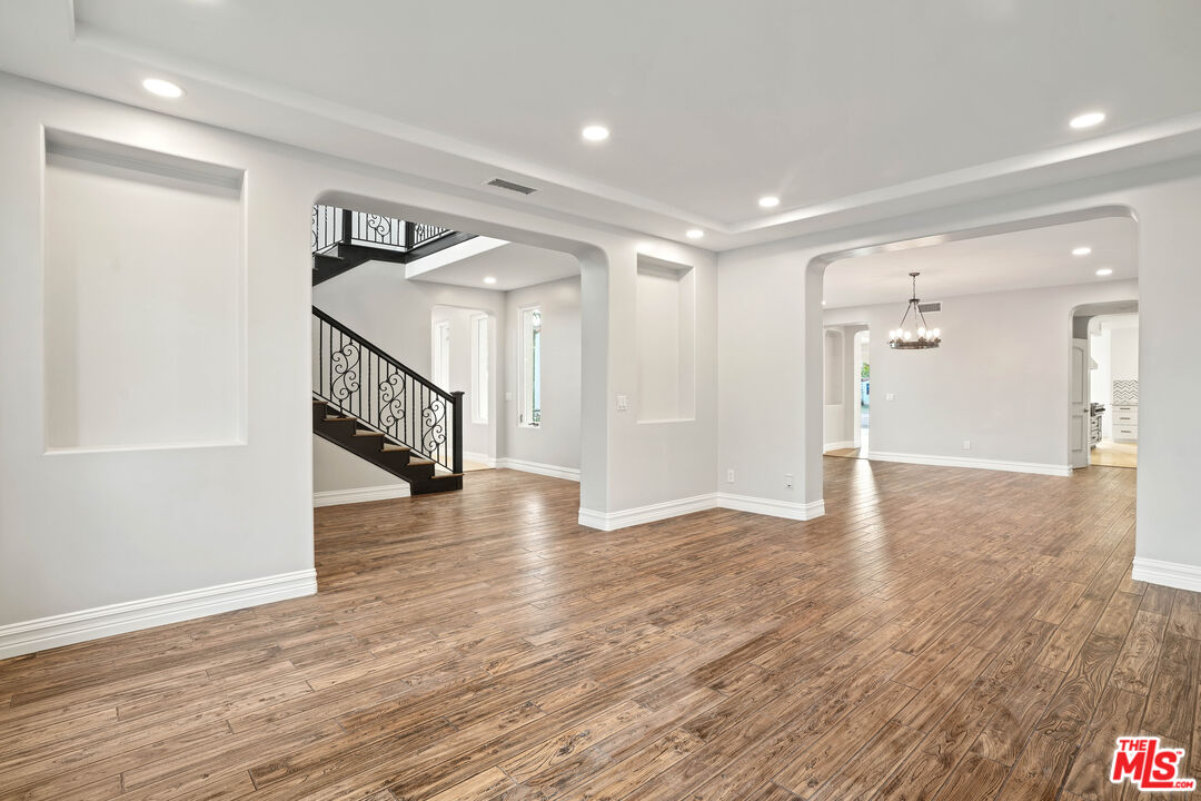 5309 Louise Avenue Encino, CA 91316 - Photo 4 of 38 a view of a hallway with wooden floor