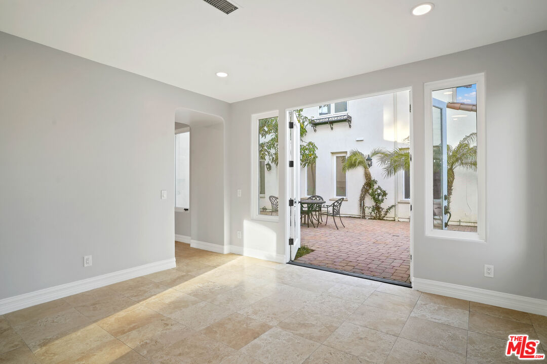 5309 Louise Avenue Encino, CA 91316 - Photo 6 of 38 a view of a room with large windows