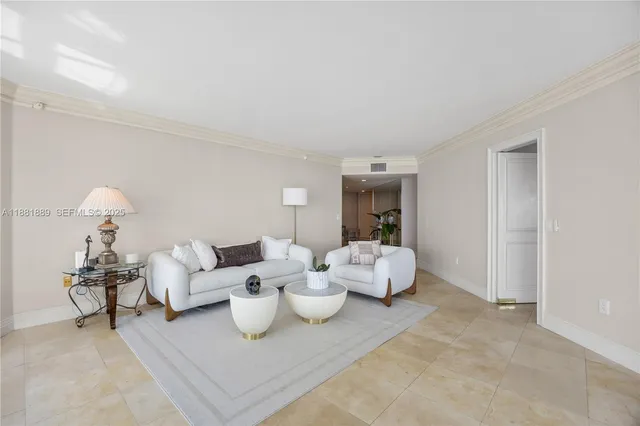a living room with furniture a large window and a dining table