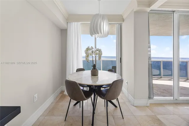 a kitchen with granite countertop a sink dishwasher stove and white cabinets