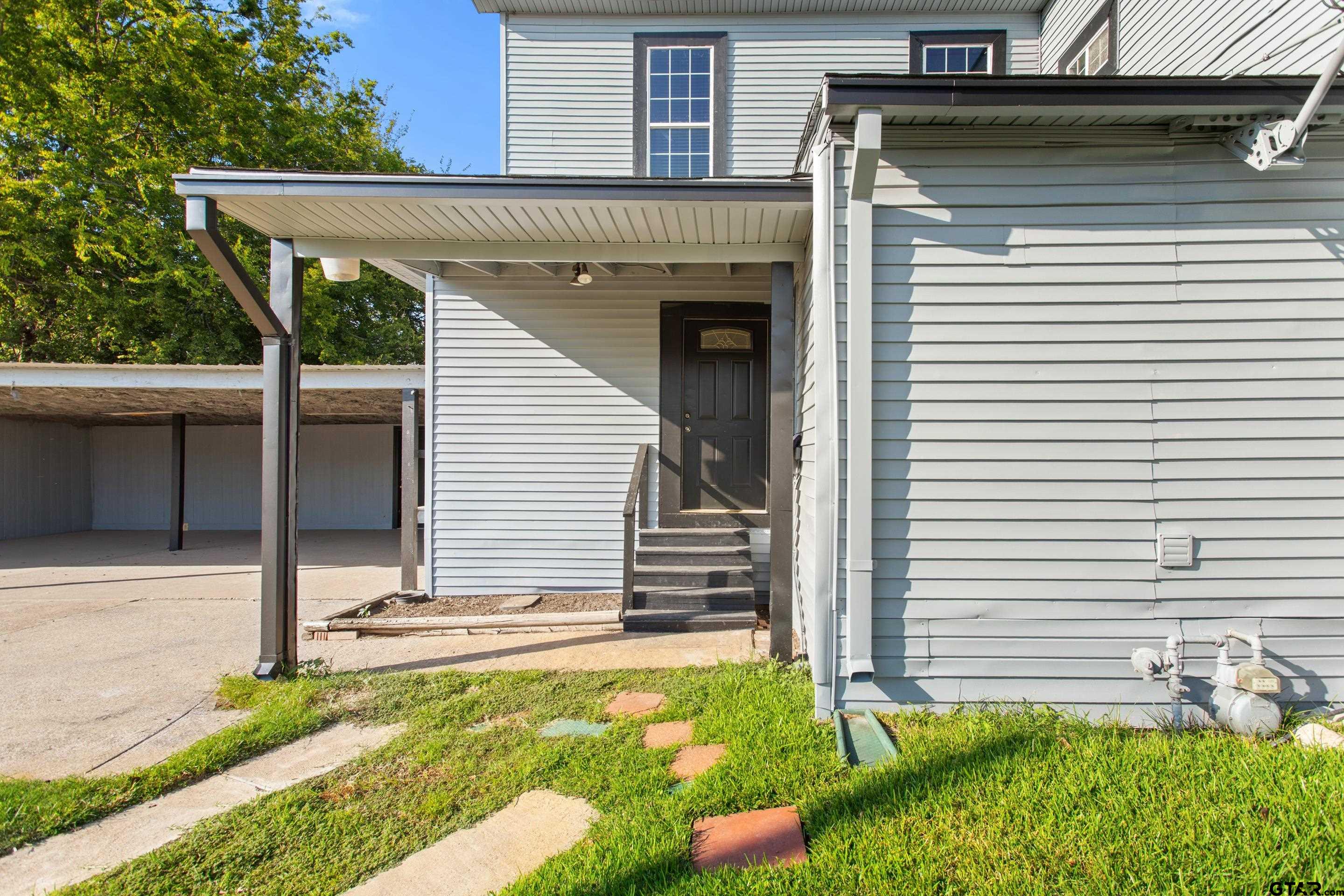 1002 North Normandy Avenue Tyler, TX 75702 - Photo 15 of 41 a view of a house with a yard