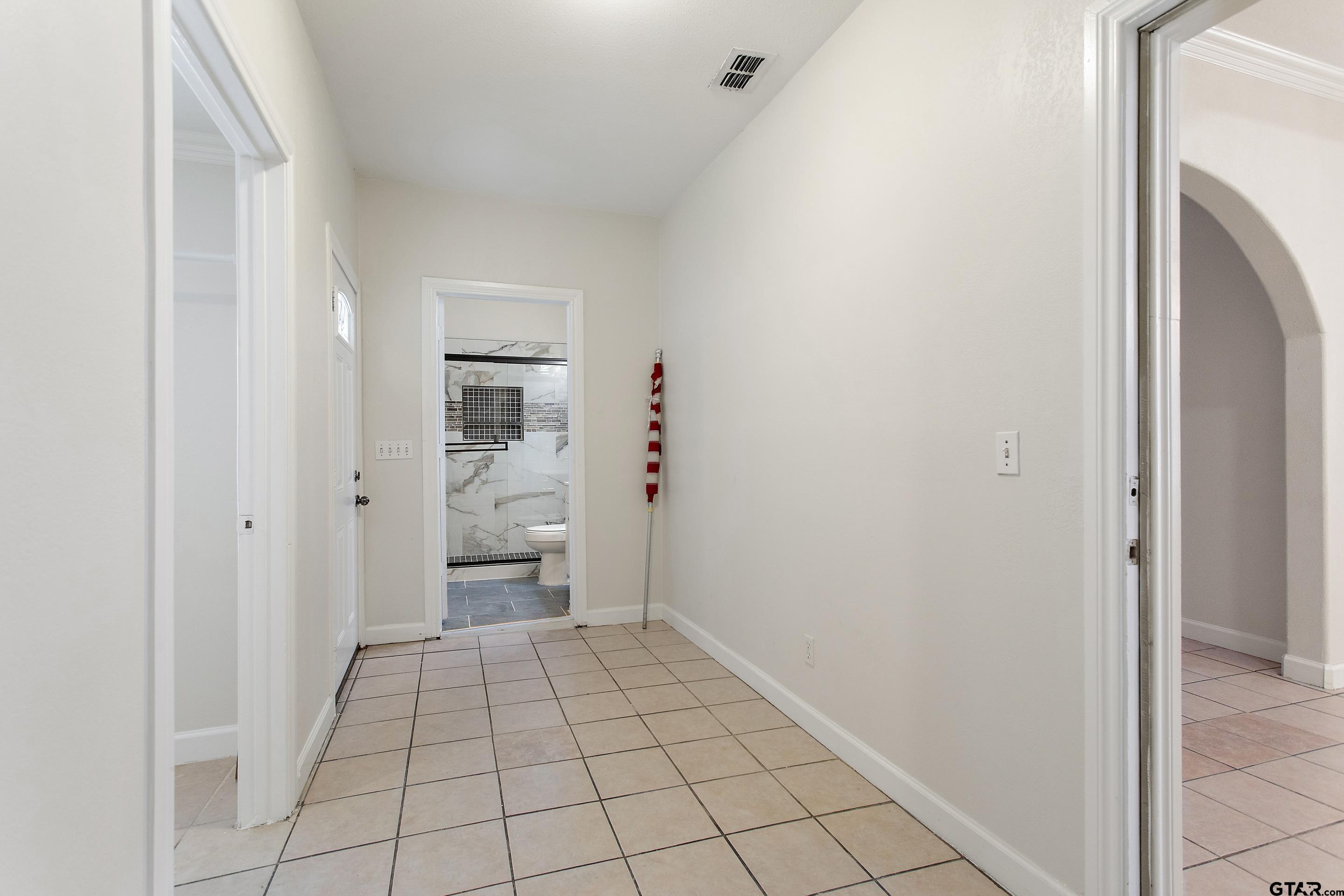 1002 North Normandy Avenue Tyler, TX 75702 - Photo 23 of 41 a view of an empty room and fire place