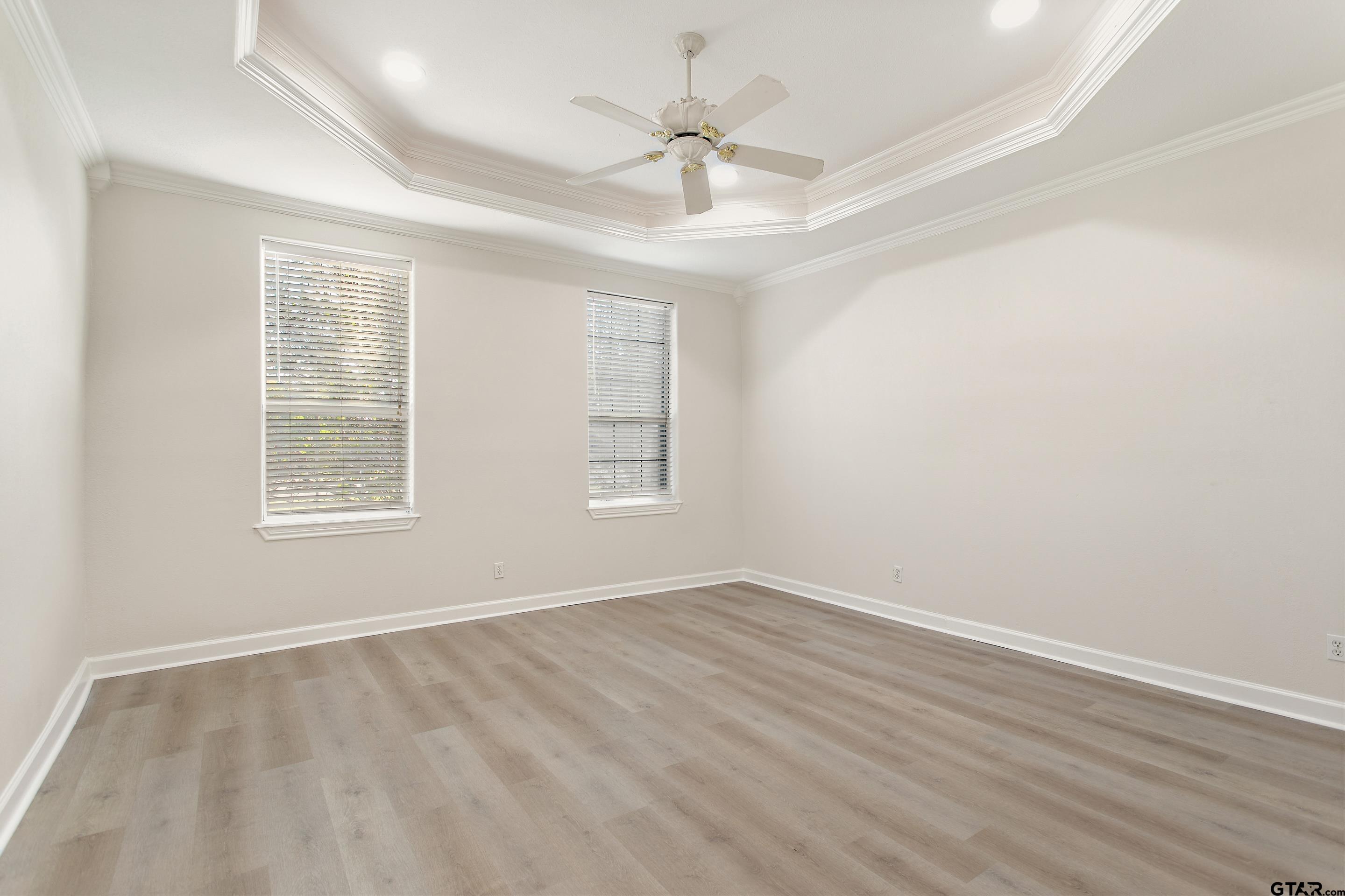 1002 North Normandy Avenue Tyler, TX 75702 - Photo 27 of 41 wooden floor in an empty room with a window
