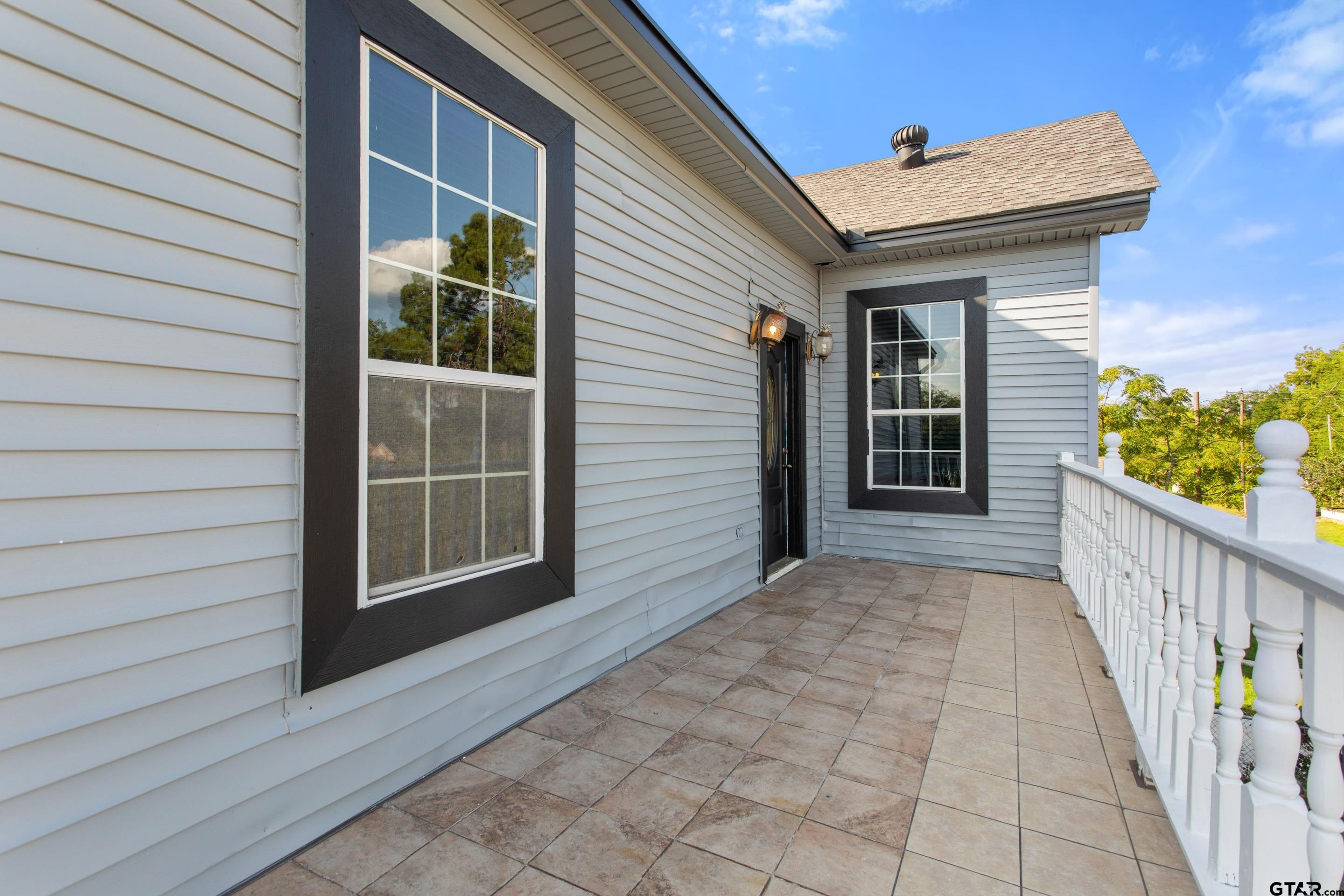 1002 North Normandy Avenue Tyler, TX 75702 - Photo 30 of 41 a view of a house with a porch