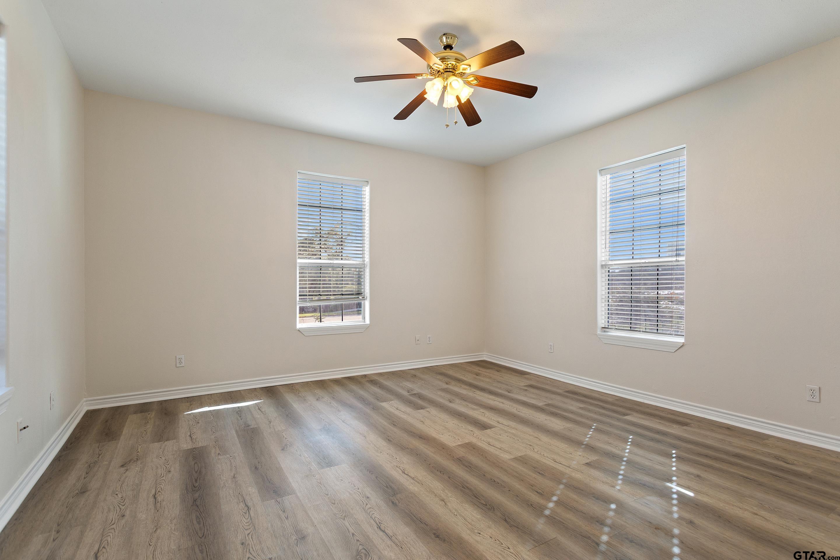 1002 North Normandy Avenue Tyler, TX 75702 - Photo 41 of 41 a view of an empty room with a window and a fan