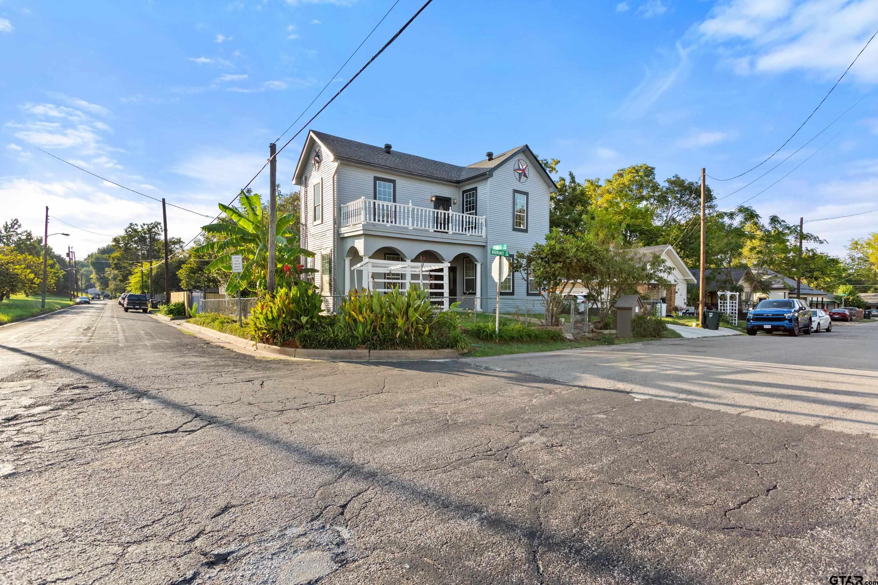 1002 North Normandy Avenue Tyler, TX 75702 - Photo 5 of 41 a car parked on the side of the road