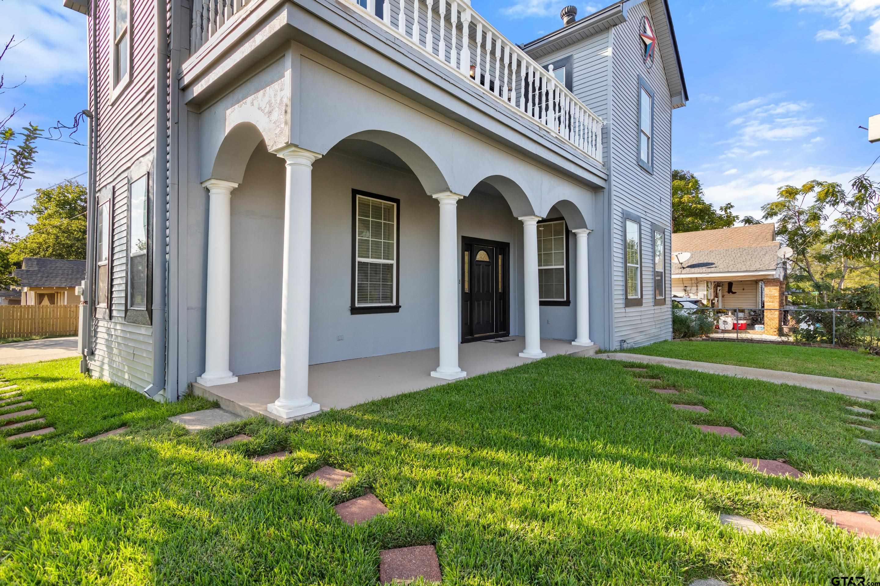 1002 North Normandy Avenue Tyler, TX 75702 - Photo 9 of 41 a view of front of a house with a yard