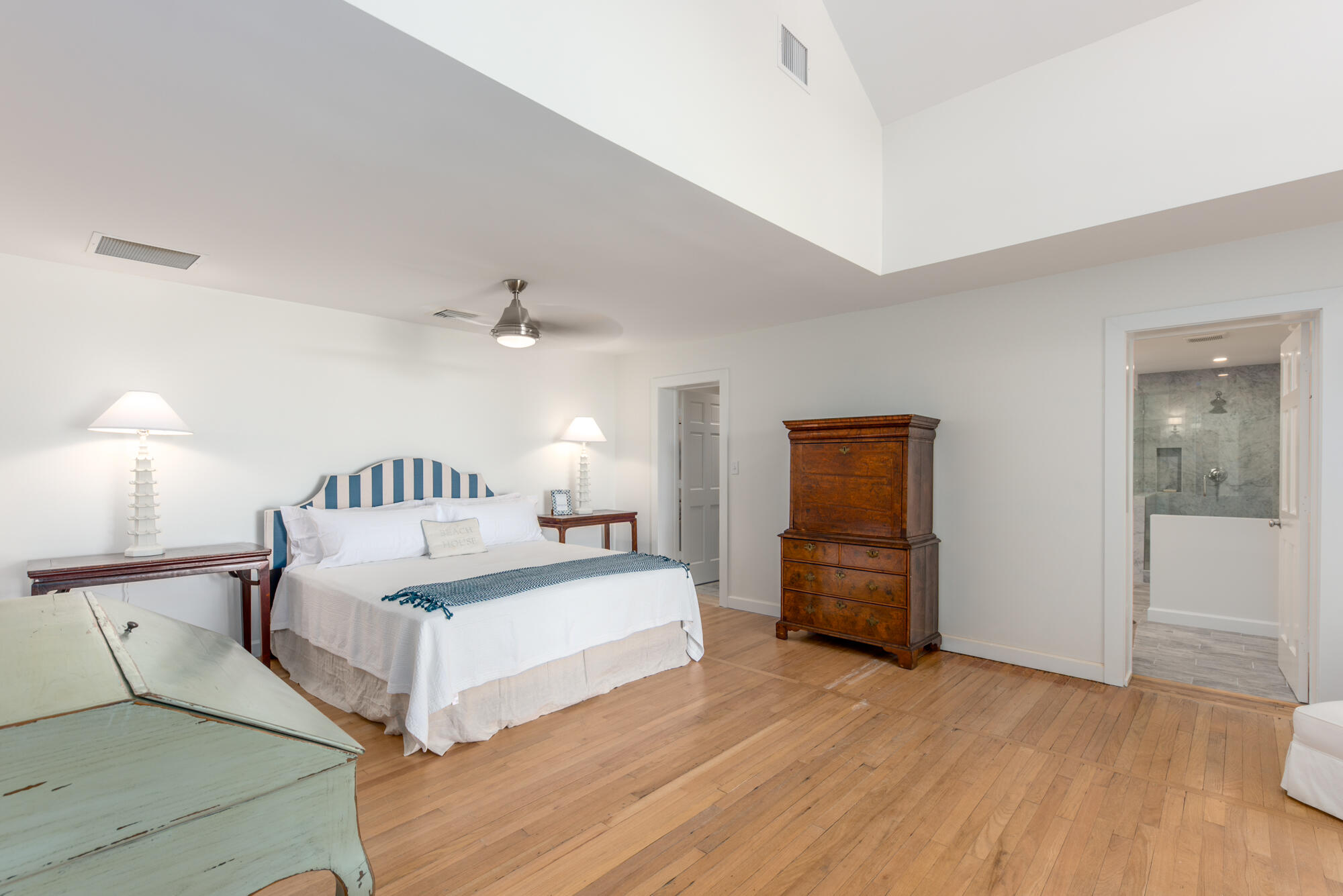 5 North Beach Road Hobe Sound, FL 33455 - Photo 15 of 26 a spacious bedroom with a bed and wooden floor
