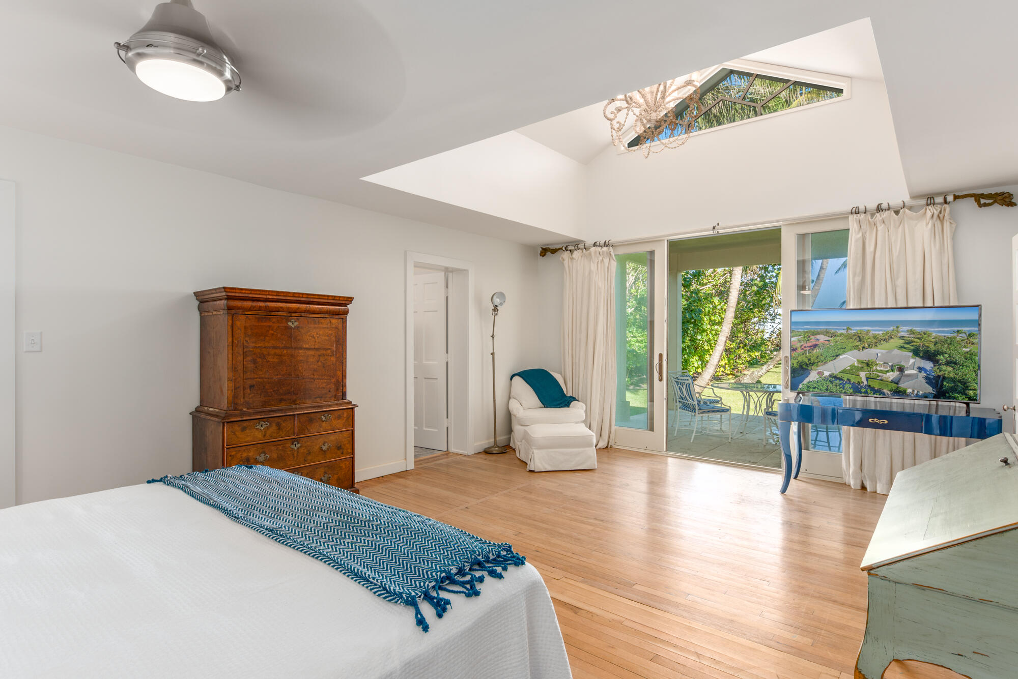 5 North Beach Road Hobe Sound, FL 33455 - Photo 16 of 26 a bedroom with a large bed and a window