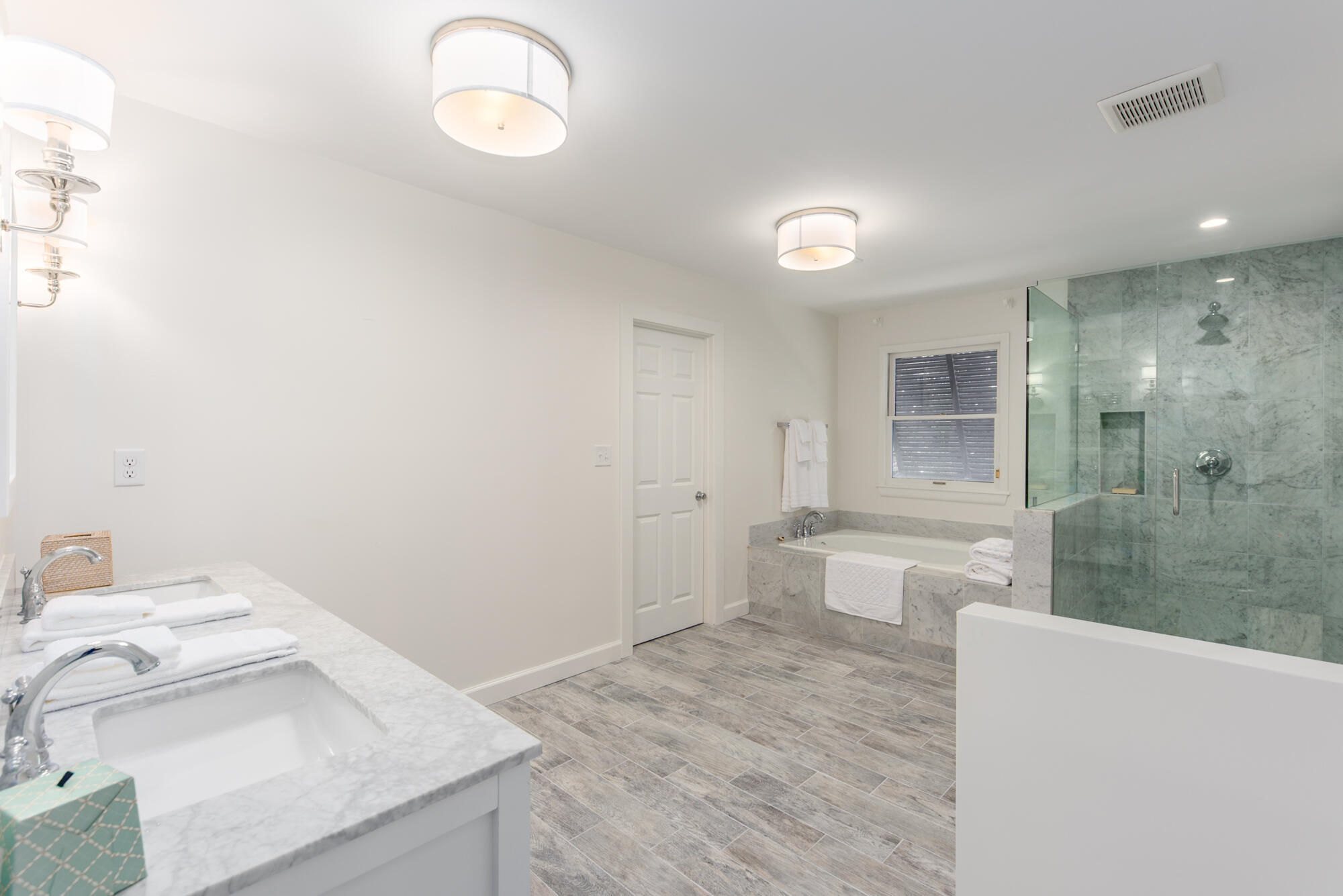 5 North Beach Road Hobe Sound, FL 33455 - Photo 17 of 26 a spacious bathroom with a granite countertop sink a toilet and a bathtub