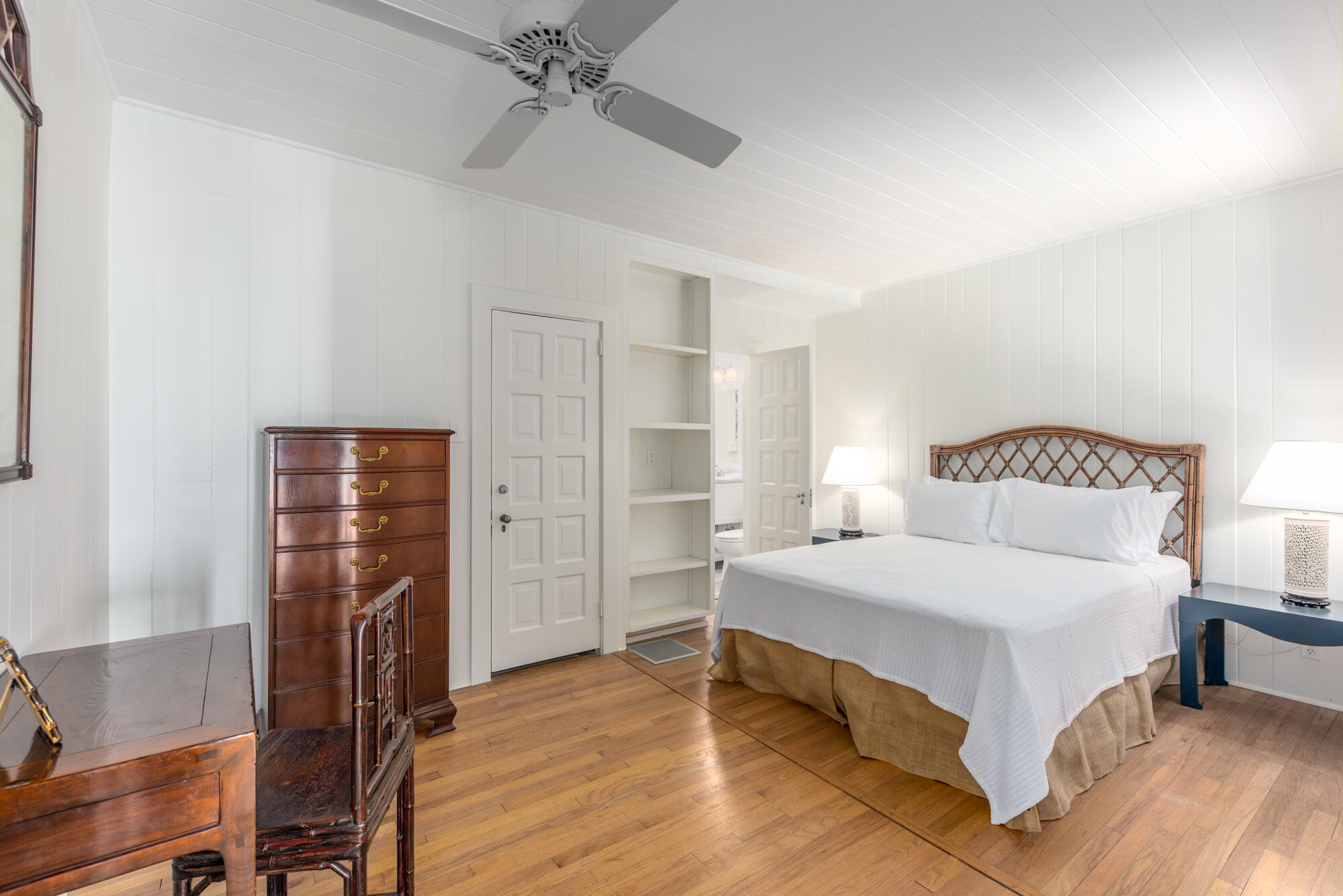 5 North Beach Road Hobe Sound, FL 33455 - Photo 20 of 26 a bedroom with a bed and wooden floor