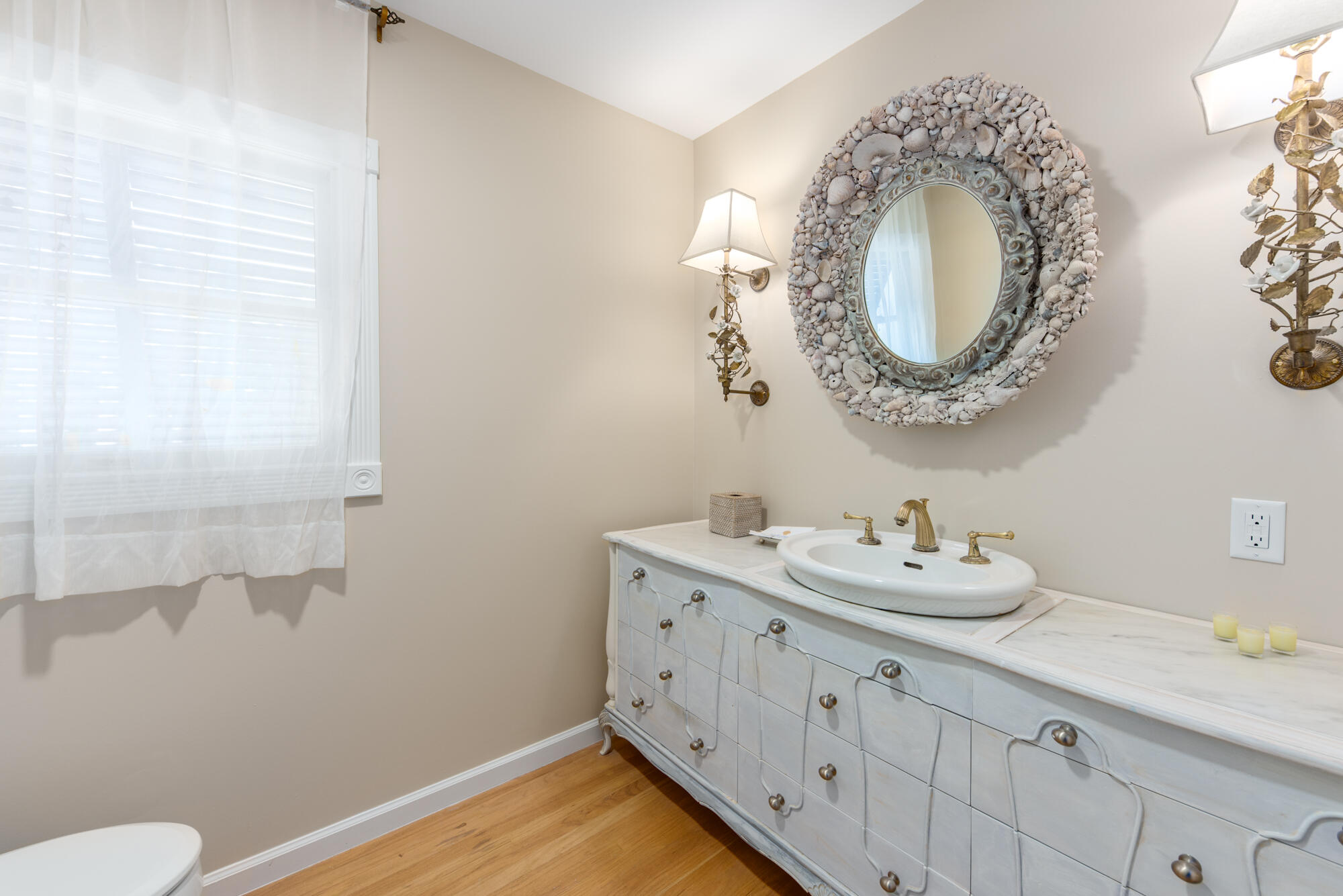 5 North Beach Road Hobe Sound, FL 33455 - Photo 22 of 26 a bathroom with a granite countertop sink and a mirror