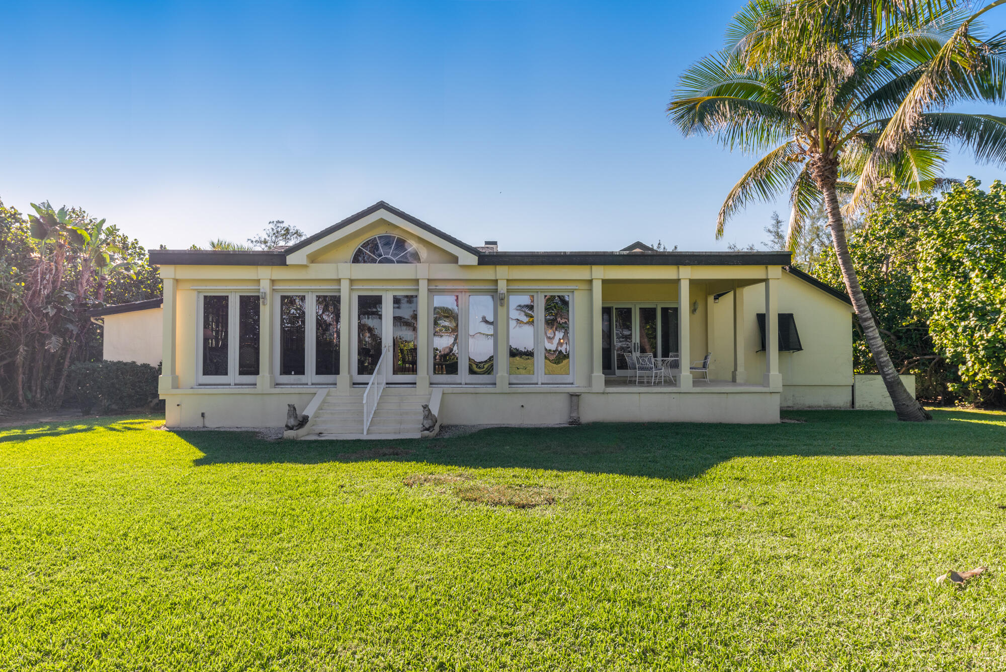 5 North Beach Road Hobe Sound, FL 33455 - Photo 25 of 26 a front view of a house with swimming pool