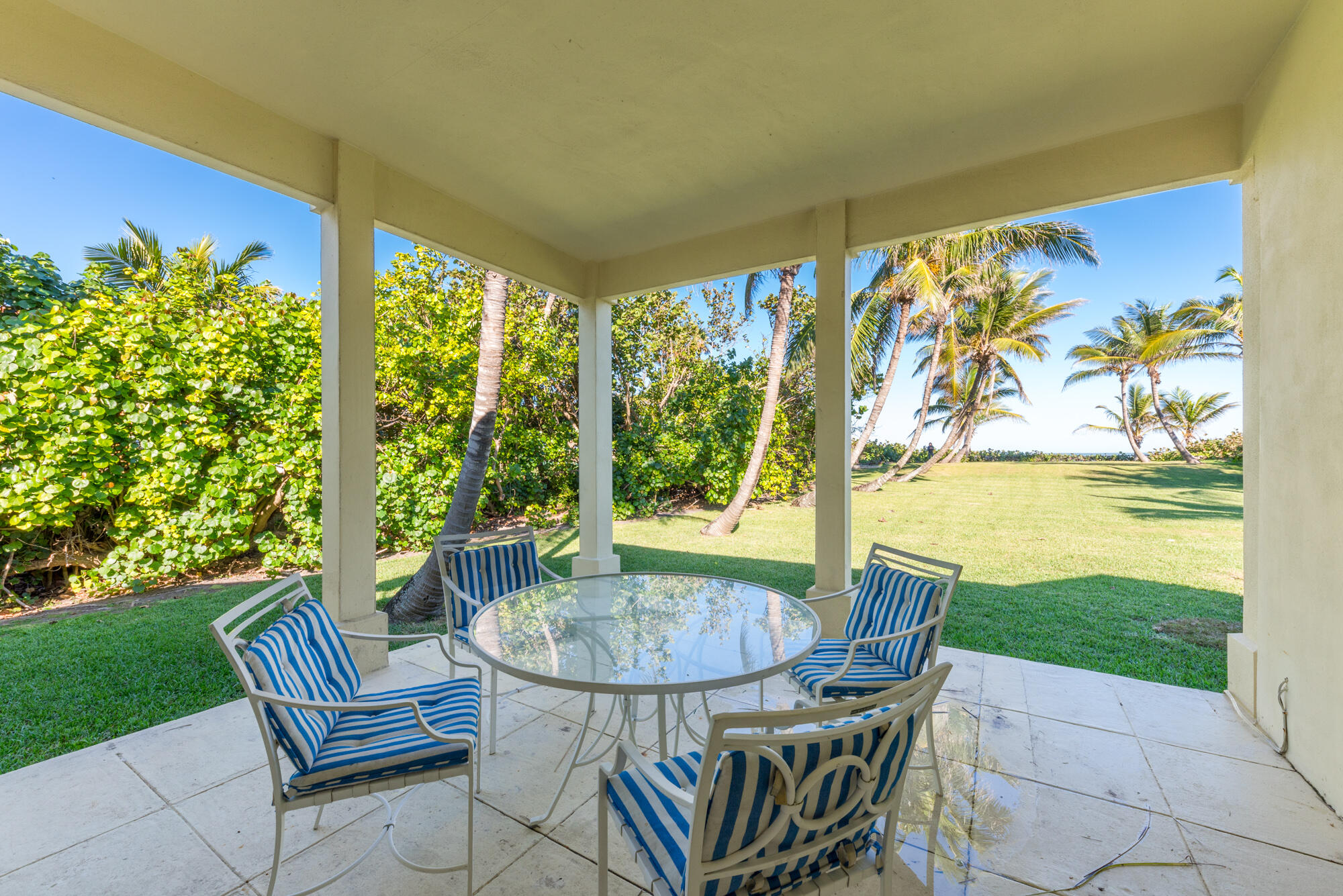 5 North Beach Road Hobe Sound, FL 33455 - Photo 26 of 26 a view of an outdoor dining space with a table and chairs