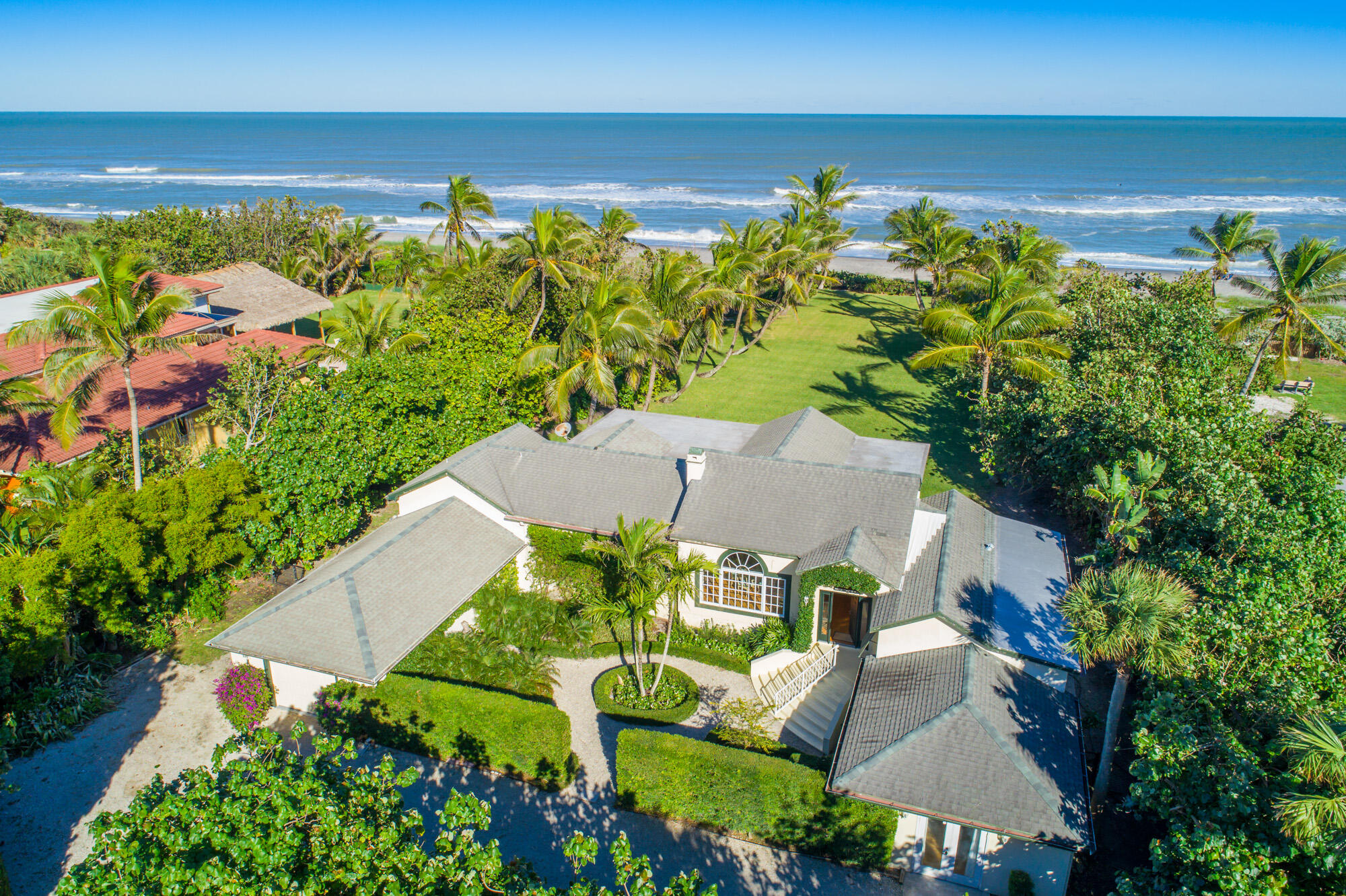 5 North Beach Road Hobe Sound, FL 33455 - Photo 3 of 26 an aerial view of a house with a yard