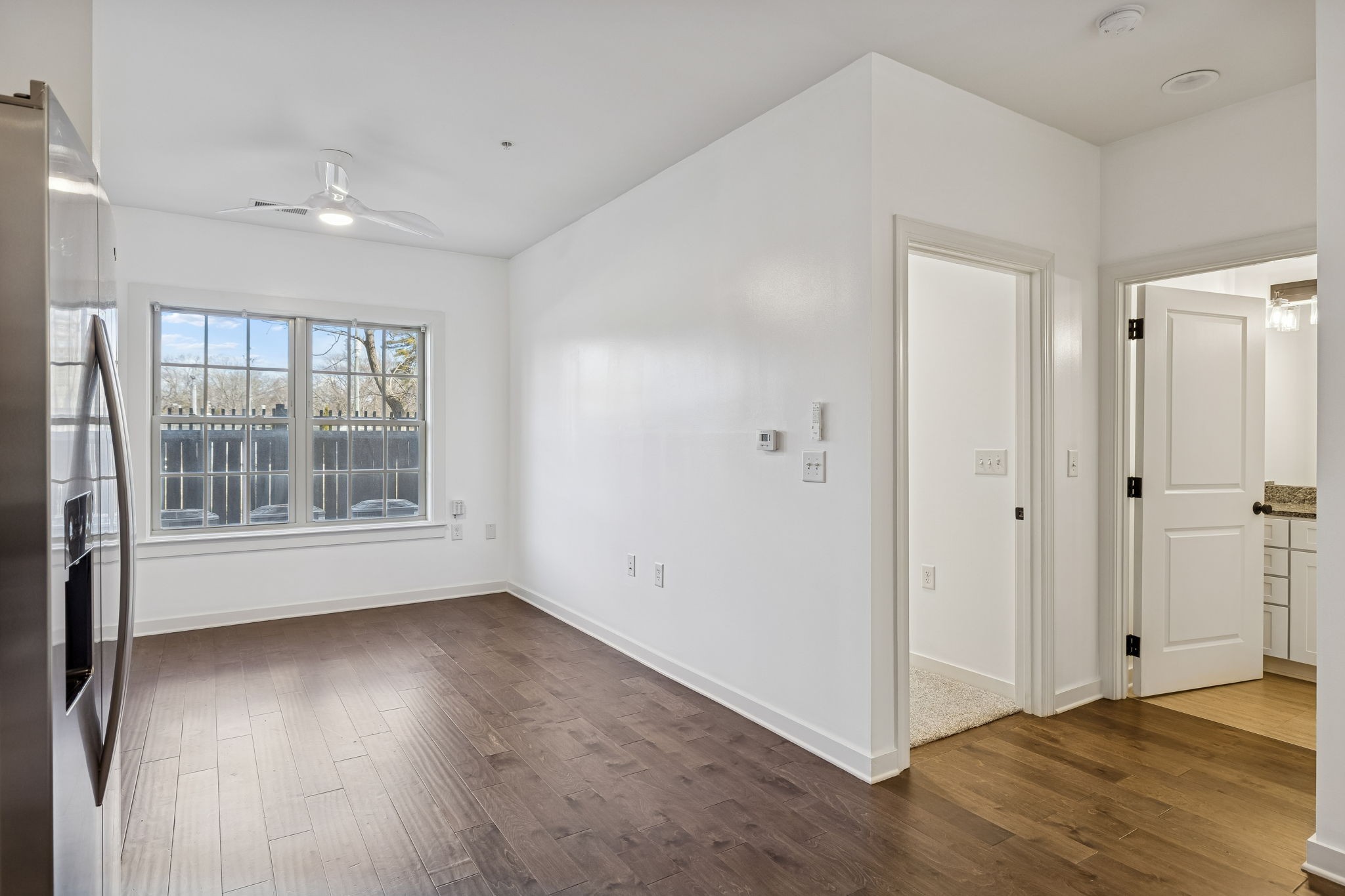 1319 West Main Street, Unit 104 Franklin, TN 37064 - Photo 8 of 20 a view of livingroom with hardwood floor and window
