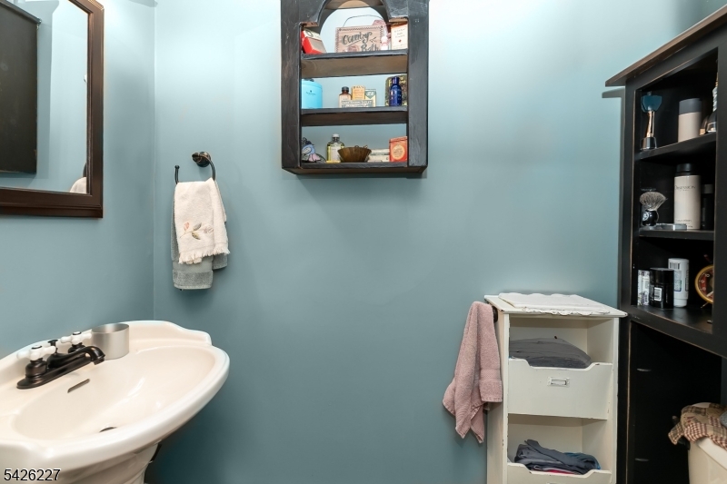 36 Main Street Flanders, NJ 07836 - Photo 19 of 49 a bathroom with a sink and a mirror