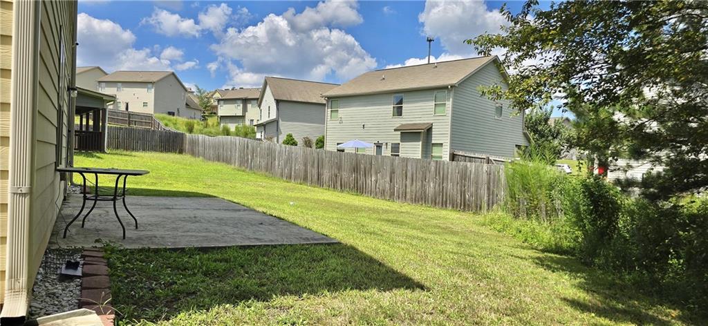 2230 Village Trail Court Dacula, GA 30019 - Photo 12 of 12 a view of a backyard with a garden and plants